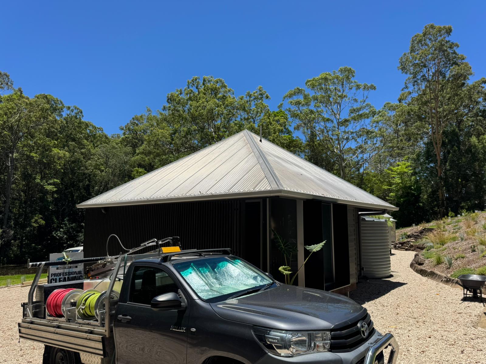 Sunshine Coast Pressure Washing ute on-site at a freshly cleaned home